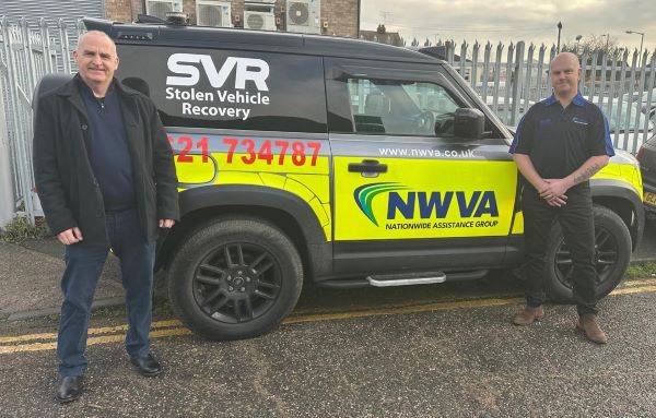 Two men beside an NWVA SVR Stolen Vehicle Recovery vehicle