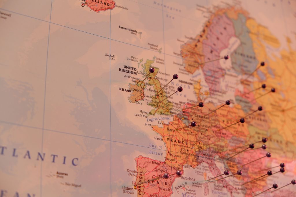 About the Group Close-up of a map with push pins marking countries in Europe, including Ireland and the UK.